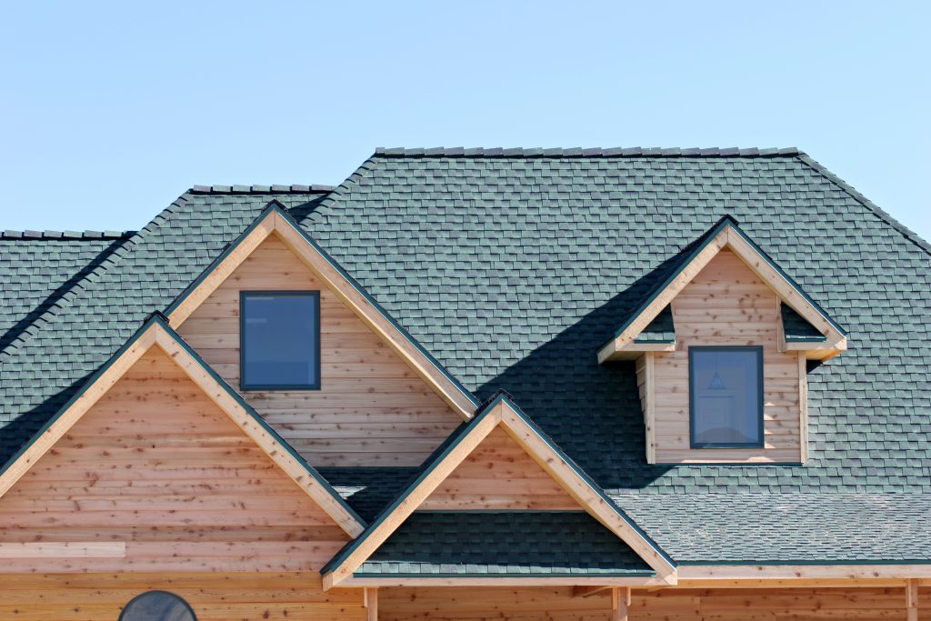 roofing architecture of a brand new home, closeup with blue sky background